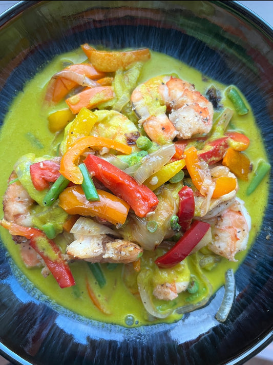 Image of shrimp and veggies in carrot ginger coconut sauce 